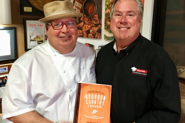 Chef David Danielson and Tim Laird, showing off their 2019 food and drink book, "Bourbon Country Cookbook." 